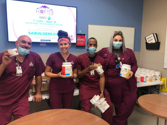 Hospital workers holding donated products from HumanN