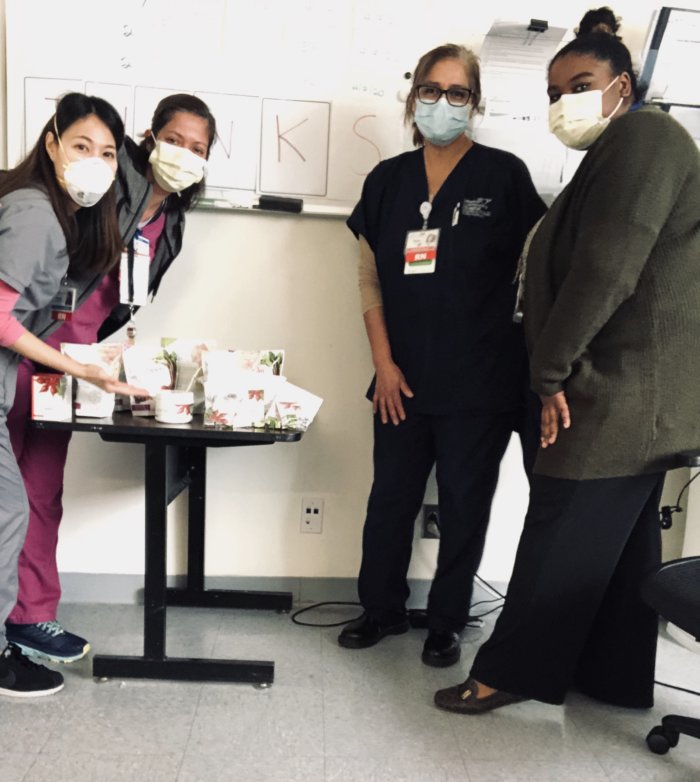 Hospital workers with donated SuperBeets products from HumanN