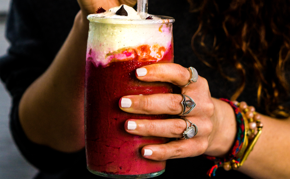 Woman holding Red Velvet SuperBeets Smoothie