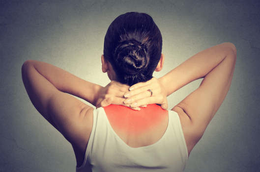 Woman with muscle pain in upper back