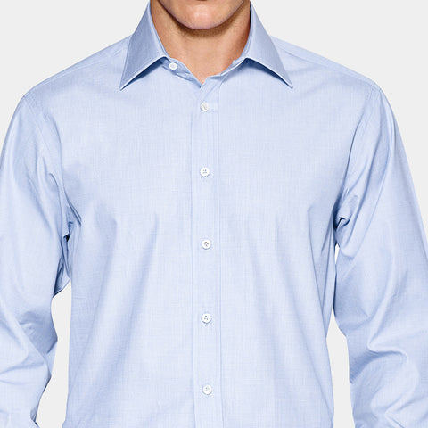 Example of Front Placket in a shirt. A white male wearing a light blue shirt