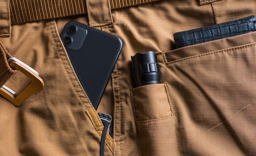 brown trouser with iphone torch and wallet