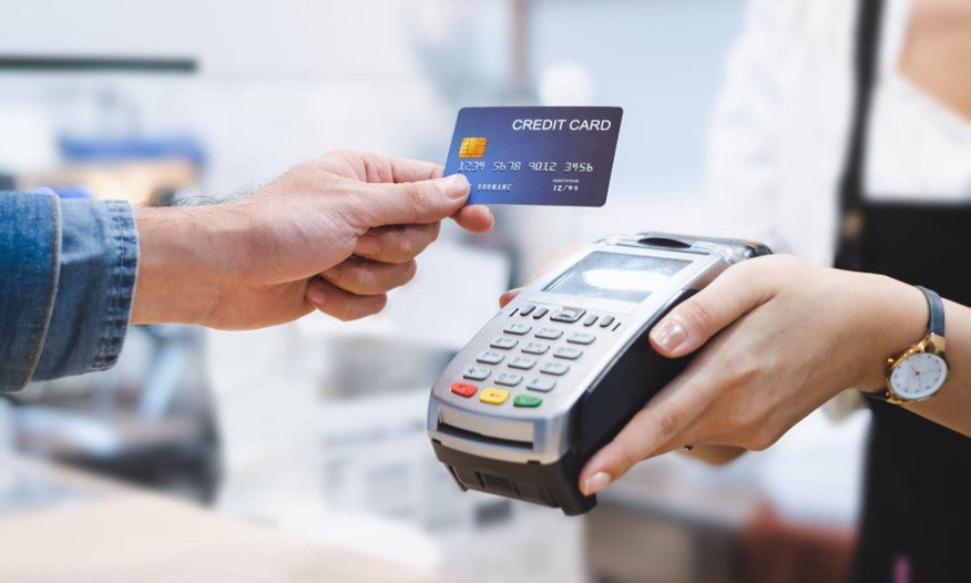 man paying with credit card