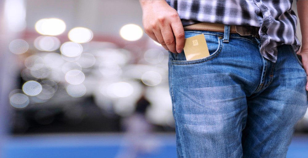 man put wallet in front pocket