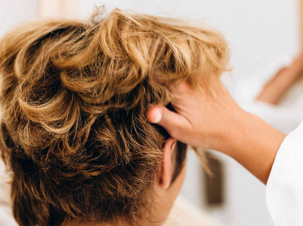 woman using amla oil for hair growth