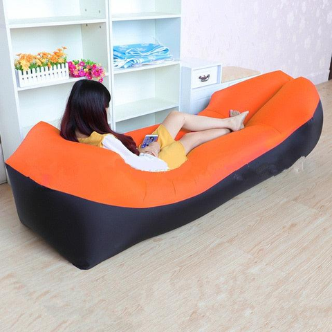 Compact and convenient, the Cloud Discoveries Air Couch Bed folded and ready for travel, demonstrating its ease of portability and storage.