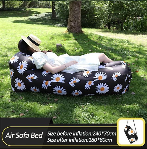 Inflatable Camping Sofa by Cloud Discoveries set up in a serene forest, illustrating its durability and suitability for outdoor adventures and relaxation.