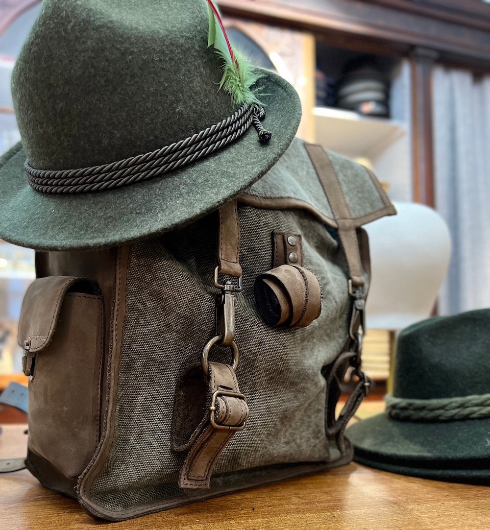 Tyrolean hat and mountain backpack