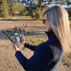 Girl Selecting a Satellite Phone in Australia