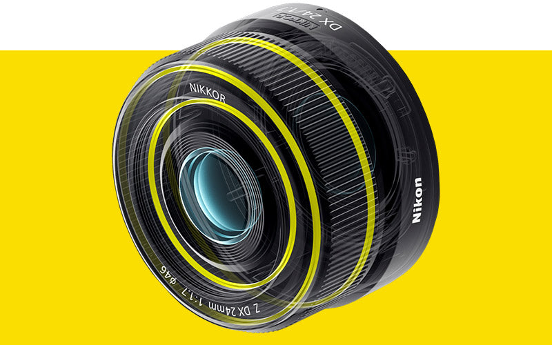 NIKKOR Z DX 24mm f/1.7 Lens with yellow highlighting showcasing the weather-sealing to protect against dust and water droplets.
