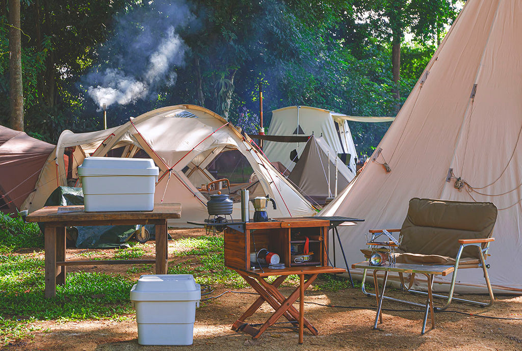 A full campsite with tents and lots of storage