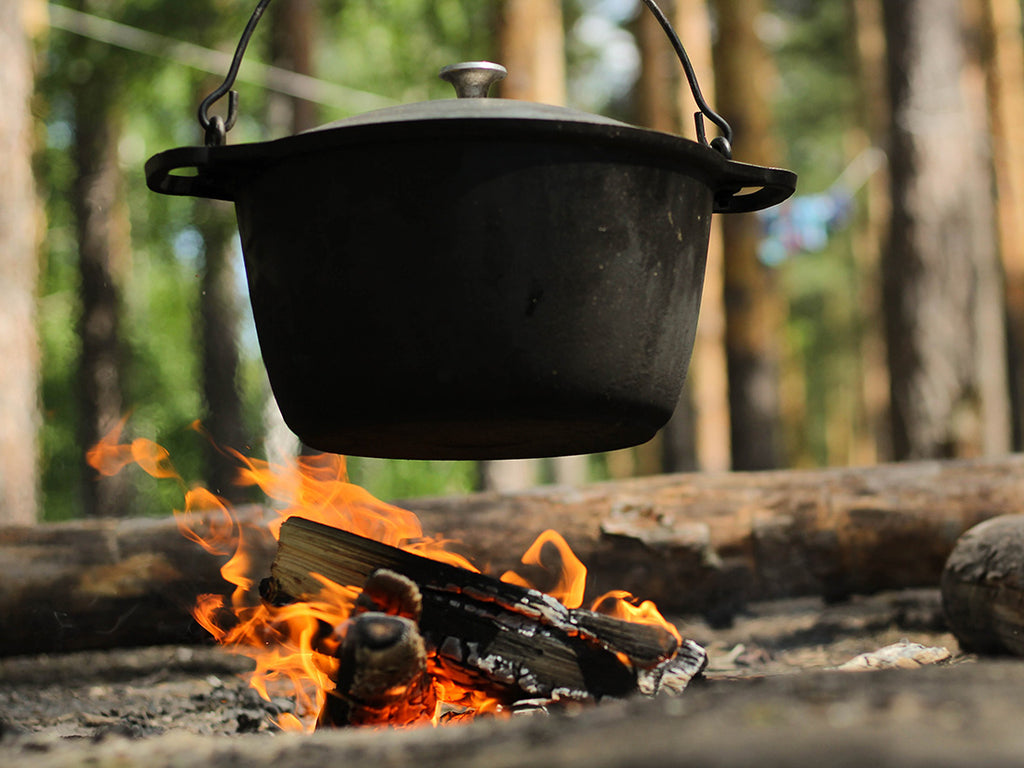 Dutch oven above a campfire