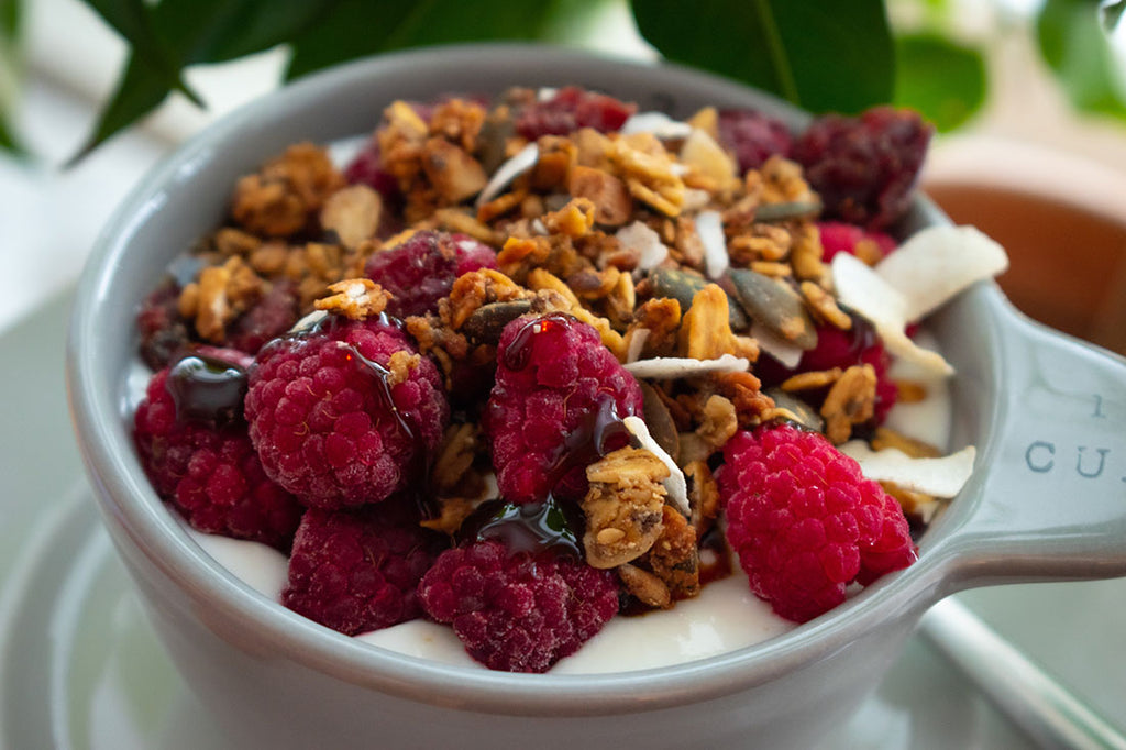 Granola and berries on top of porridge