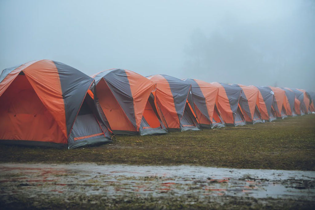 A row of tents in heavy rain