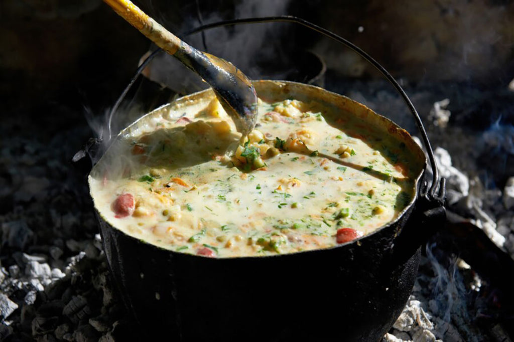 A pot filled with creamy soup