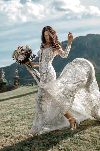 Villa Evalina in Lake Como, Italy bride flying her dress with a lush bouquet