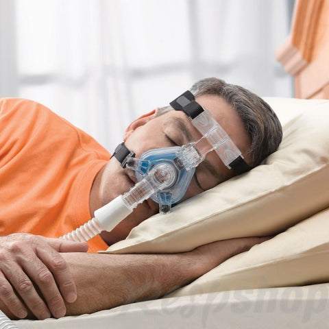 Person sleeping with an oxygen mask