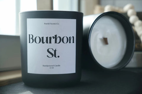 a New Orleans candle called Bourbon Street in a black vessel with a white label