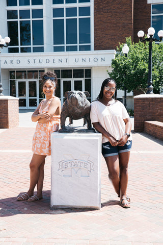 Aaliyah & Alexa at Mississippi State University in front of the Colvard Student Union