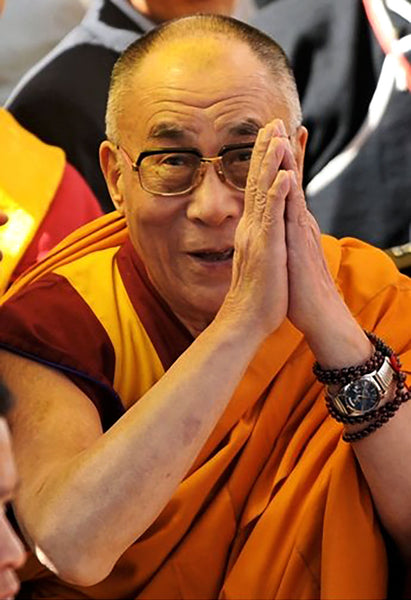 His Holiness wearing a Rolex Day-Date Ref. 18038 on an elastic metal strap.