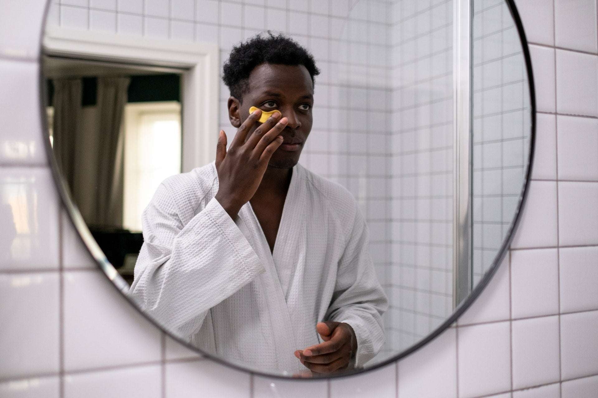 Man Doing Skincare Routine to Experience Vitamin C and E Serum Benefits