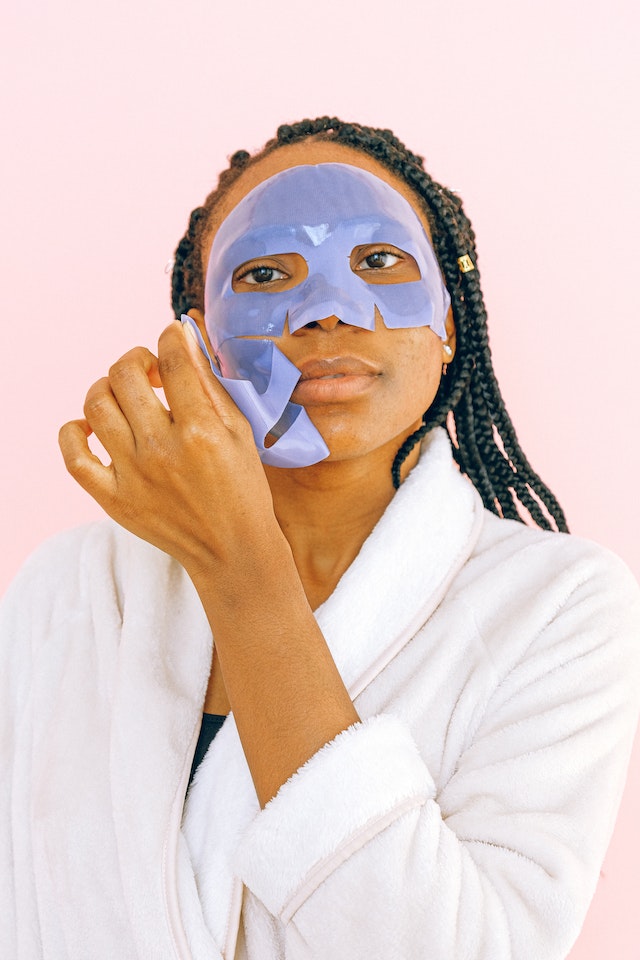 Woman removing silicone face mask