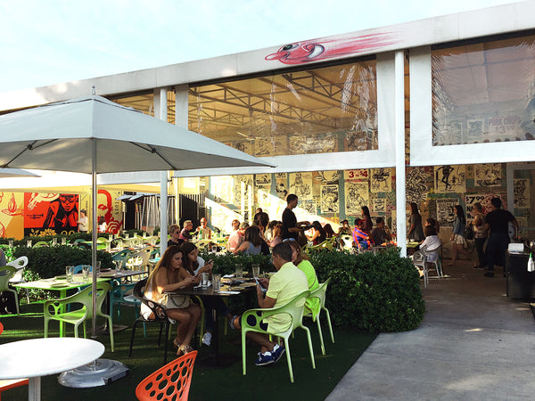 Local restaurant with umbrella seating outdoors