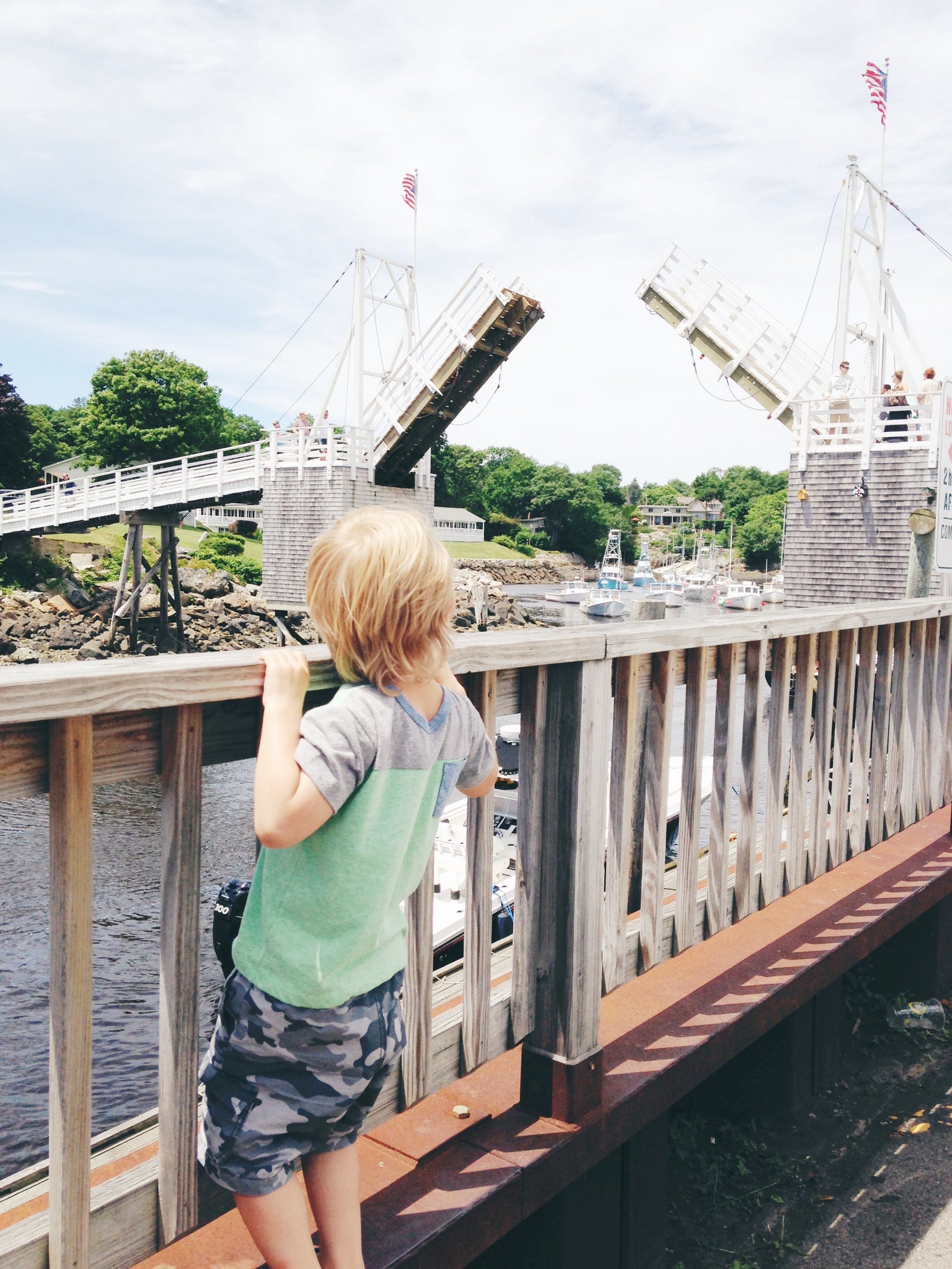 Little boy on pedestrian drawbridge