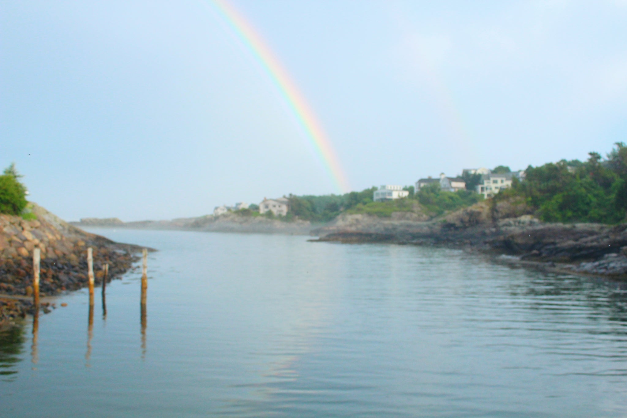 Rainbow over harbor Maine
