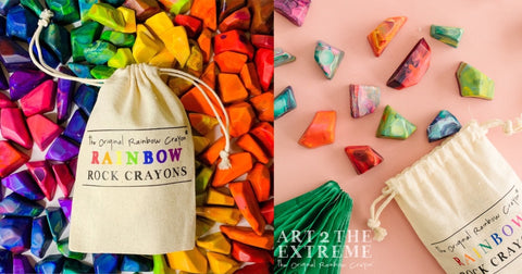 Crayon rocks from Art 2 the Extreme®, image of beige bag with Rainbow Rock Original Rainbow Crayons logo on outside. Colorful multicolored crayon rock are displayed