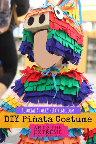 Kids DIY piñata costume for Halloween. Image is of a toddler boy wearing a piñata inspired costume for a Halloween costume contest.