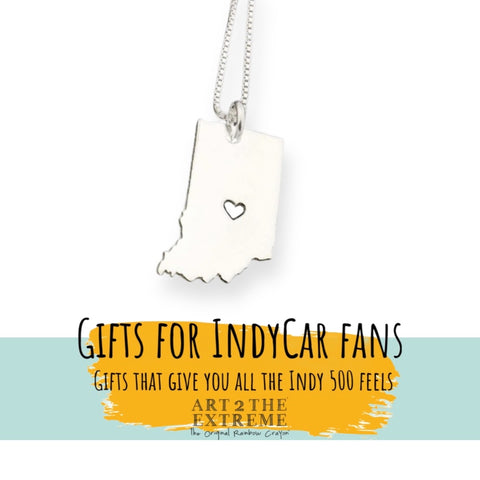silver necklace in the shape of the state of Indiana with a hear where Indianapolis is.