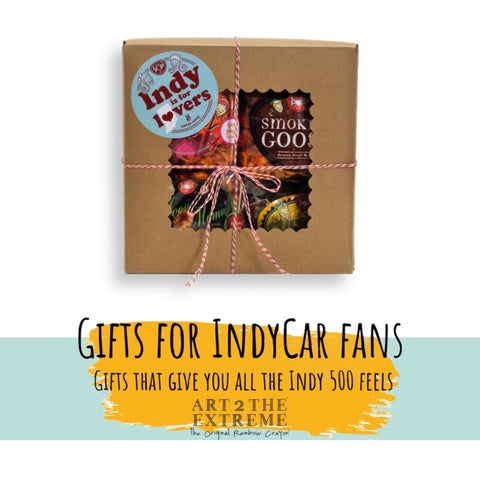 Brown box of Local Indiana Love Gift Box of Indiana Food tie with string. You cannot see what is inside very well, but there is a sticker that says Local Love on the front.