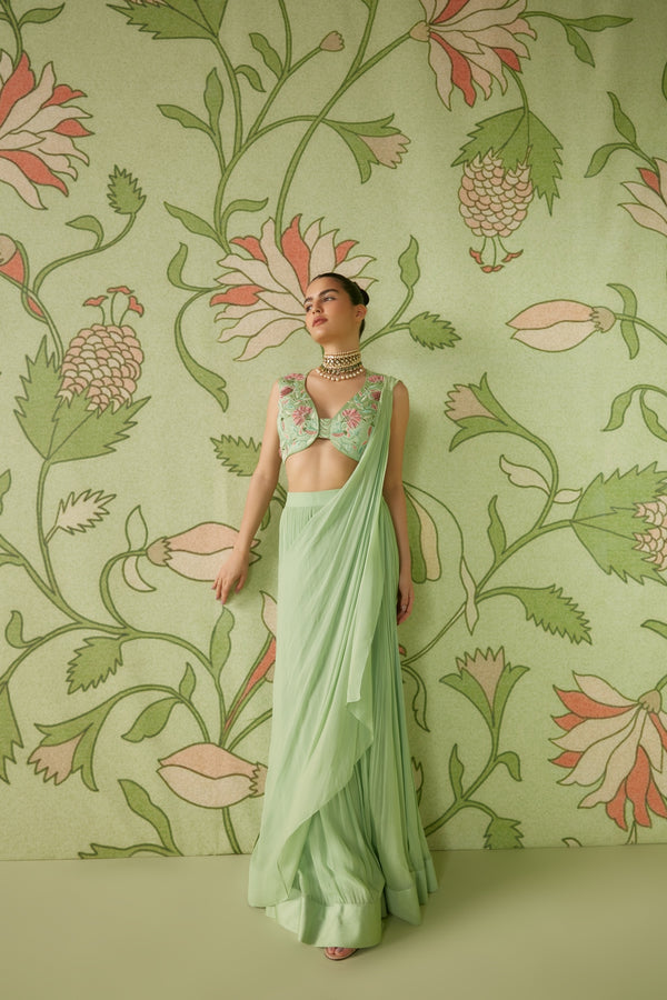 Milan Design - Suave in sage green! Subtle elegance is the motto this  festive season. Embodying it, is this exquisite sage green saree with self  coloured embroidery highlights surrounding one of a