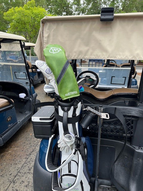 Two Headcovers on golf cart one Clubhouse one Bluetross Collection