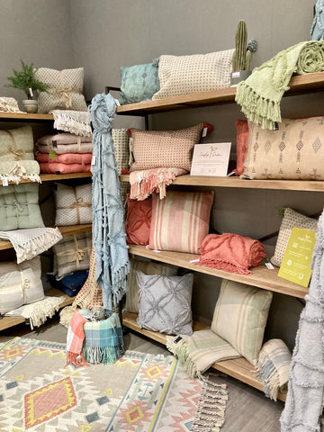 Homewares including cushions and throws made from recycled plastic bottles at Source for the Goose, Devon