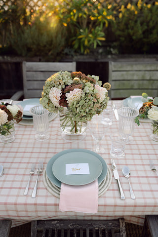 set table with green ceramics and florals