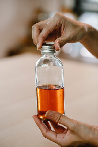 natural skincare in glass bottle