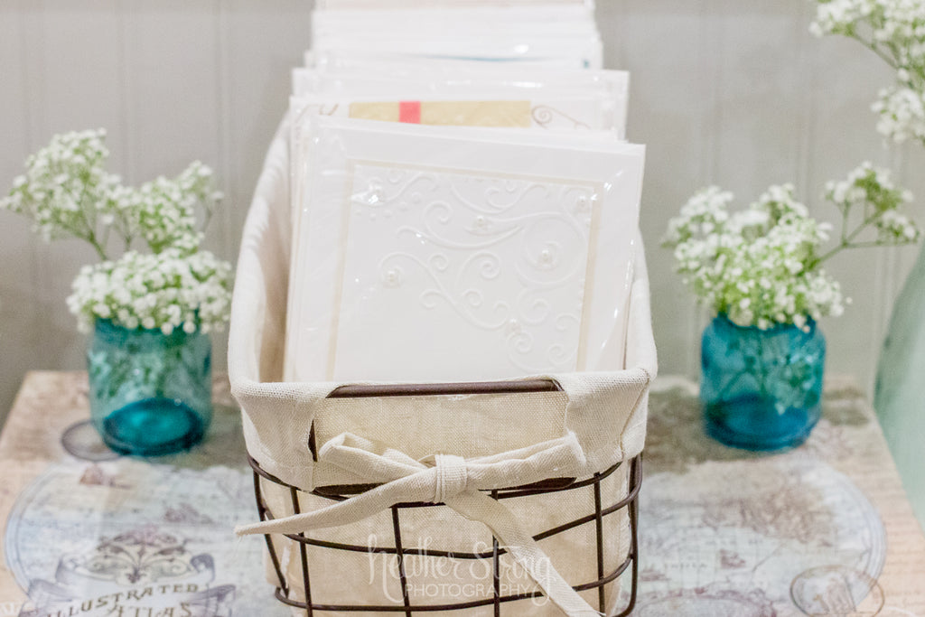 Blue stained glass jars, basket, and handmade cards