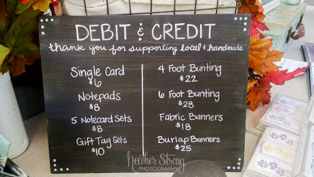 Pricing sign at craft fair booth