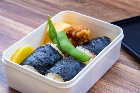 Bento box with onigiri and takuan