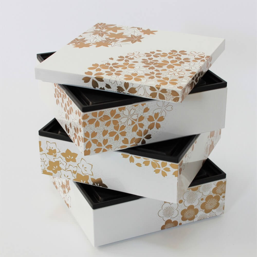 https://cdn.shopify.com/s/files/1/0582/3407/7380/files/white-picnic-bento-box-spirally-stacked.jpg?v=1693807548&width=1000