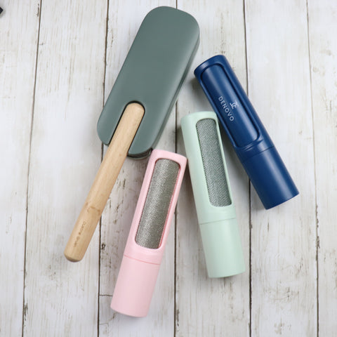 self cleaning lint brushes in blue, green and pink