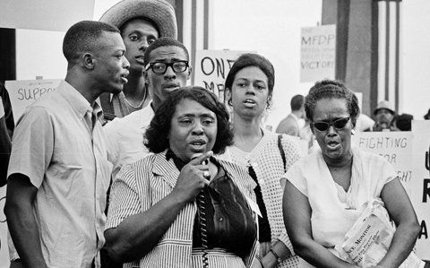 fannie lou hamer at a rally speaking into a megaphone