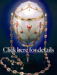 Firebird’s Dawn objet de art, ostrich egg art object adorned with gold, rubies and diamonds. Shown upright on gold stand.