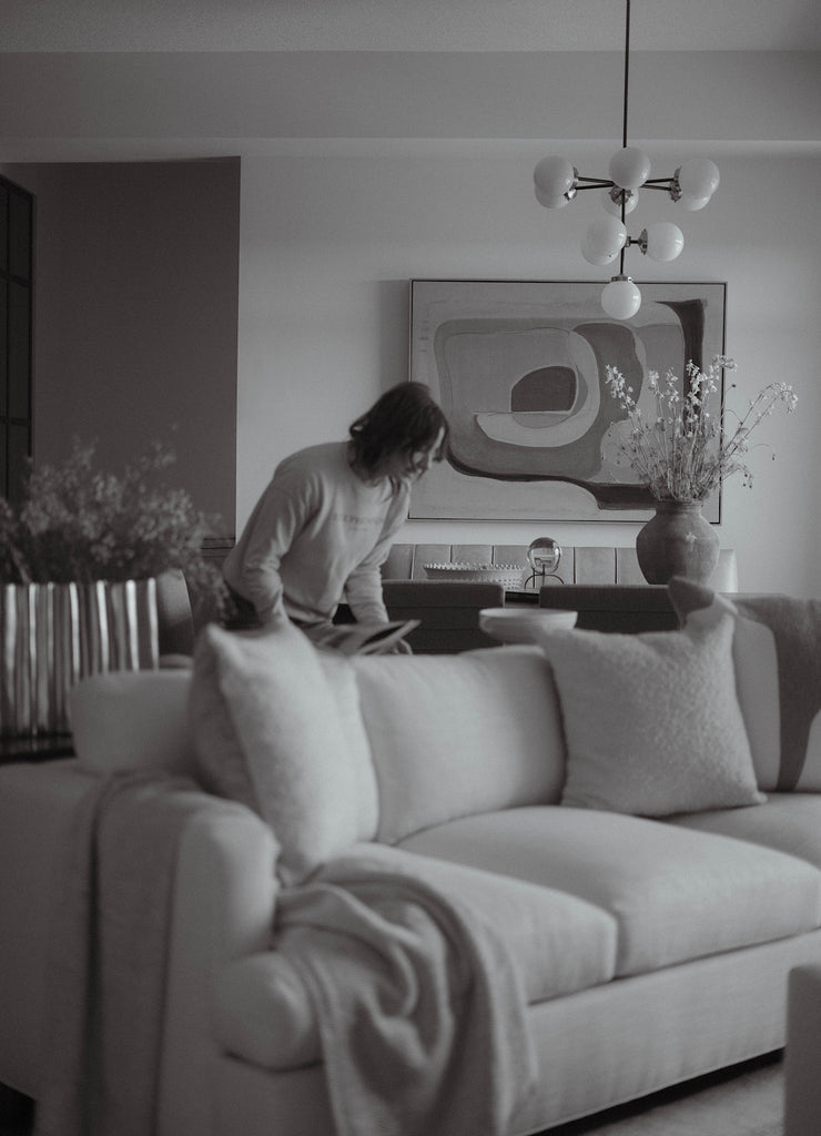 Interior designer Katie Stephenson, owner of Stephenson House, styling the living room space at project Valley's Edge.