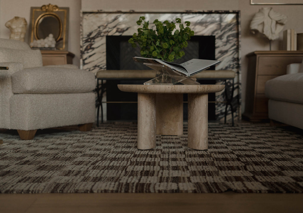 A styled living room with a focus on The Chester Rug.