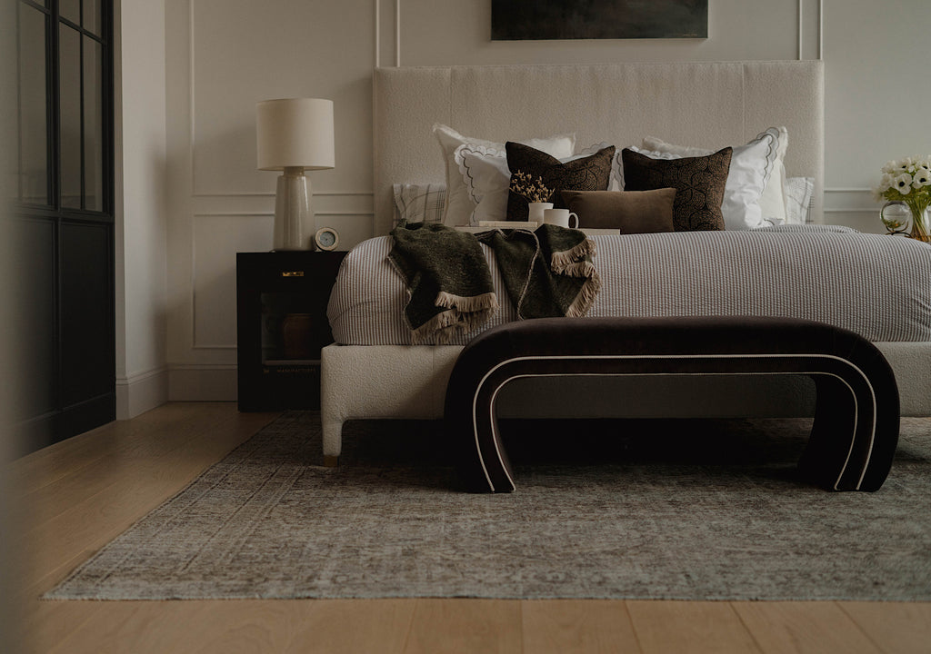 A styled bedroom with a focus on The Simona Rug.