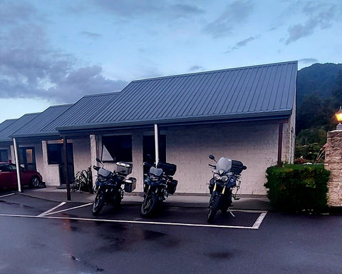 motorbikes parked outside motel room