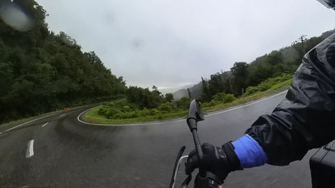 Motorbike on curve in rain